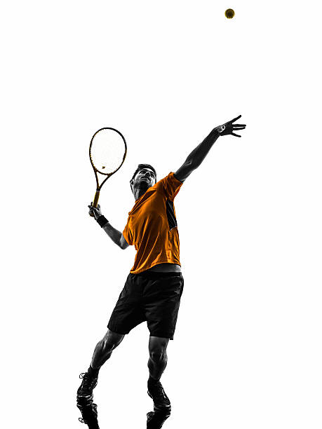 istock man tennis player at service serving silhouette 186282171