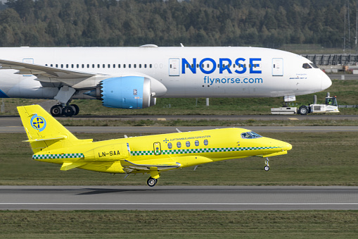 Norwegian Air Ambulance Cessna Citation landing Oslo Airport Gardermoen, in front of a Norse Dreamliner