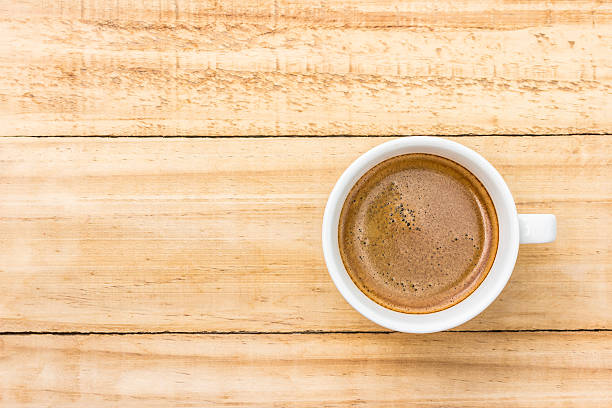 istock coffee in white cup on wood background 186282721