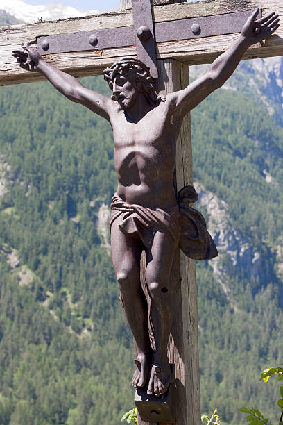 istock Christ Jesus hangs on a wooden cross 186285763