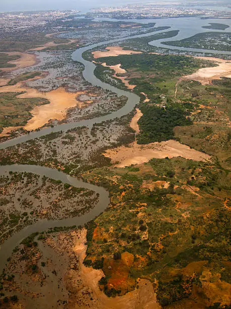 Aerial view of the river with the sea in the background