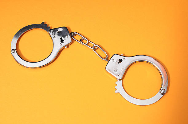 istock Pair of Handcuffs 186286057