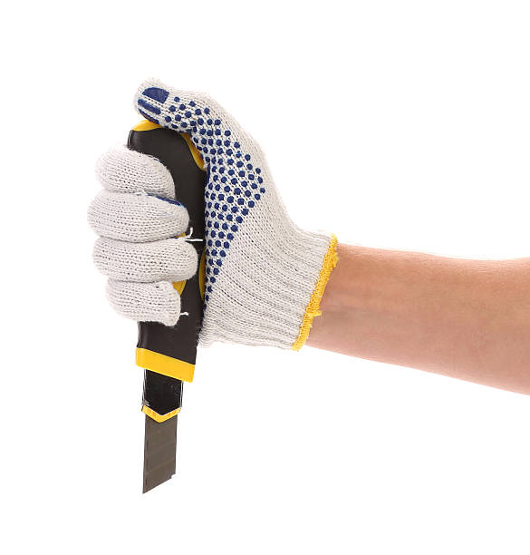 istock Hand in gloves holding knife. 186288728