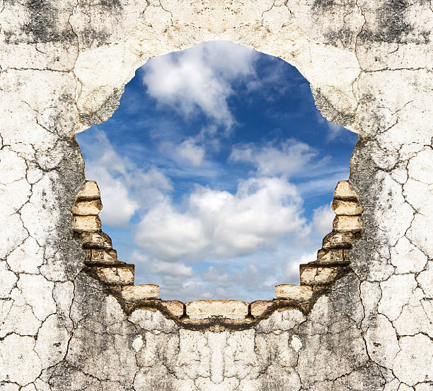 istock Hole in old  brick wall and concrete  background with sky 186289525