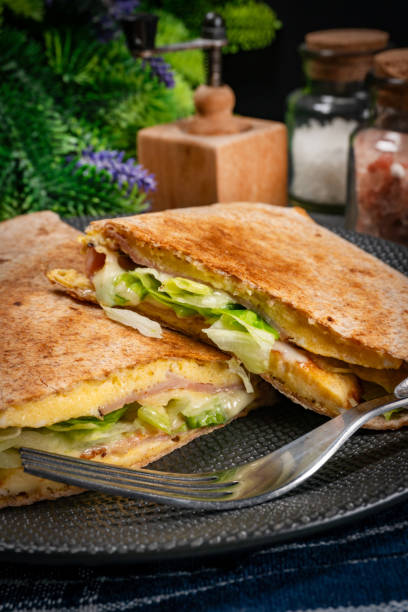 istock Tortilla multigrain with omelette, lettuce and ham. 1862896168