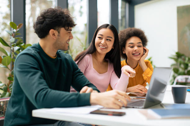 istock Multiracial students discussing educational project and ideas, studying indoors, sitting in coworking space 1862898240