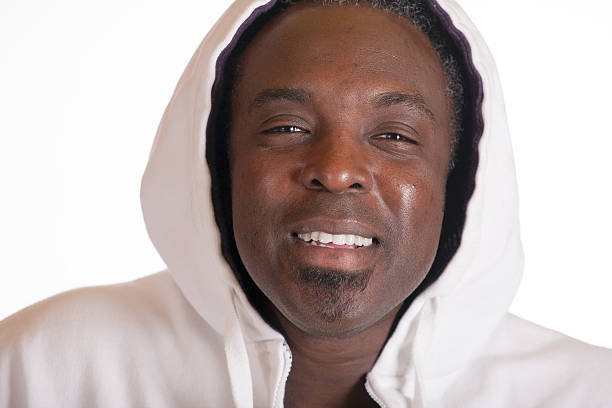 African American in sweat suit jacket with hood stock photo