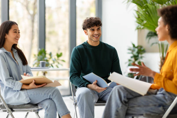 istock Happy multiracial students friends talking and discussing educational project together, sitting on chairs in circle 1862899344