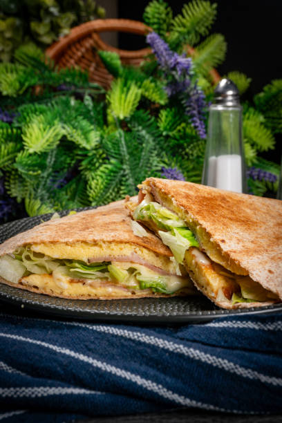 istock Tortilla multigrain with omelette, lettuce and ham. 1862902970