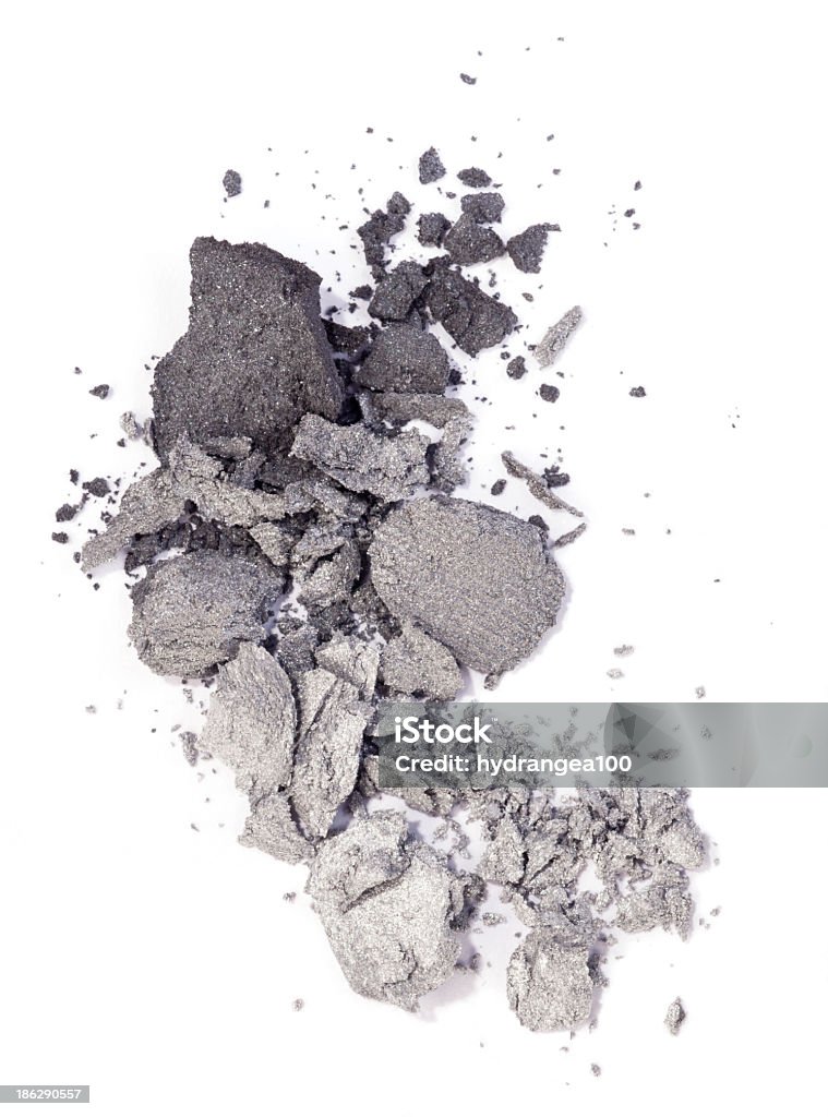 Gray shades of eyeshadow powder on a white background Grey and silver eyeshadow isolated on white background Crumb Stock Photo