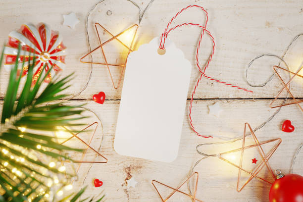 istock Holiday tag with lights on the wooden background mockup. 3D rendering 1862909681
