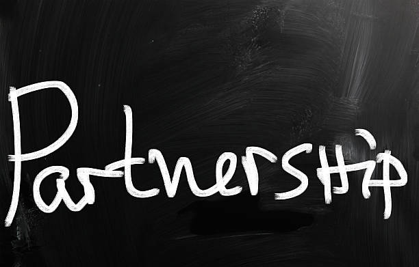 istock 'Partnership' handwritten with white chalk on a blackboard 186293952