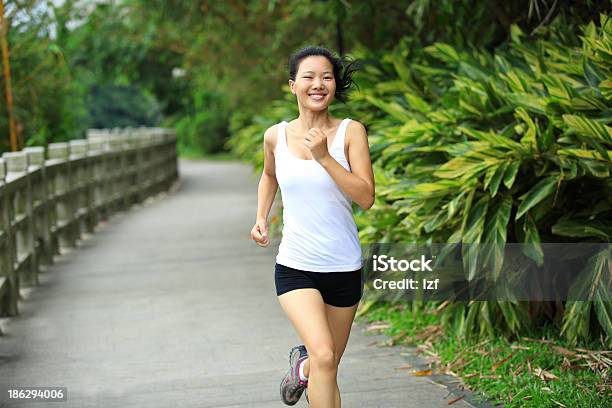 Healthy Woman Running Stock Photo - Download Image Now - Front View, Sprinting, Women