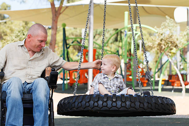 istock Dad play with son outdoor at park 186294617