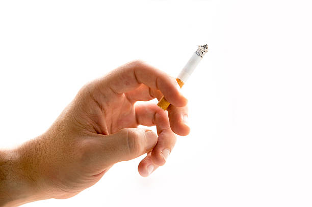 istock Male hand holding a cigarette 186294736