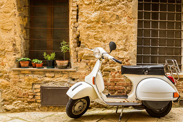 Vintage scene with Vespa on old street Vintage scene with Vespa on old street. siena italy stock pictures, royalty-free photos & images