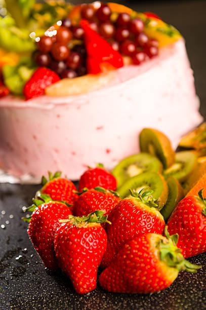 istock Fresh strawberries and kiwis with fruit cake 186297206