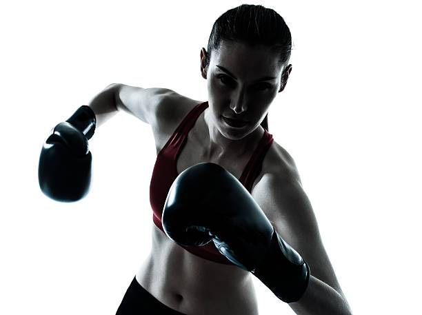 istock beautiful woman exercising box silhouette 186297318