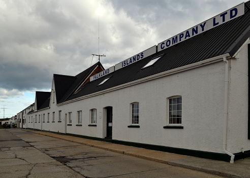 Stanley, East Falkland, Falkland Islands: headquarters of the Falkland Islands Company Ltd. (FIC), FIH Group, on Crozier Place - the largest commercial player in the Falkland Islands, and is involved in a number of business segments, Retail sales through several stores in Stanley and Mount Pleasant, accommodation, shipping, port services, property, insurance, etc. The company was established in 1851 by Alexander Ross Lafone and was originally involved in agriculture and trade. For over 100 years, the main business was the sale of wool from the company's many sheep farms. By 1945 FIC owned 4,900 km² of land in the Falkland Islands and operated both business and shipping. In 1962, the company was listed on the London Stock Exchange. After several sales, the company became independent again in 1997 through the establishment of Falkland Islands Holdings. In the meantime, the agricultural properties had been sold to the Falkland Islands authorities.