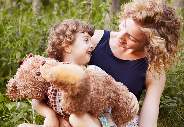 istock Mother and daughter portrait with a teddy bear 186297633