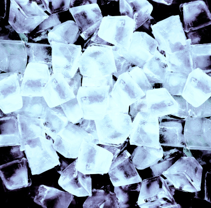 Abstract background with ice cubes in black light