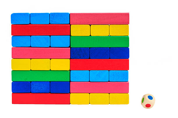 istock collapsed wooden blocks tower and dice colorful toy 186298488