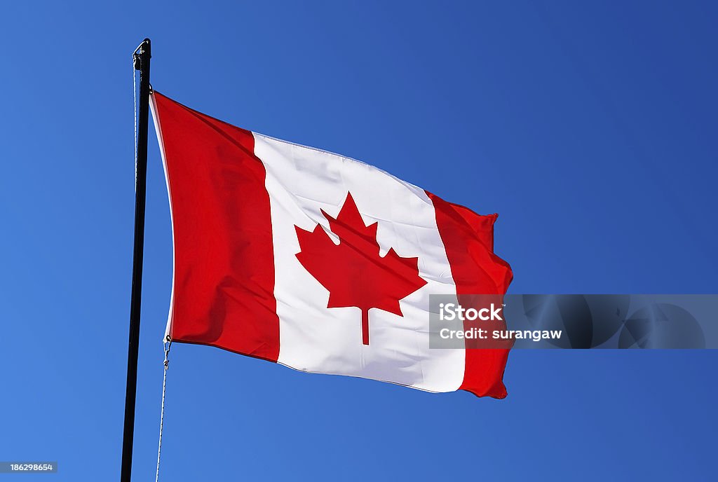 Canada flag on blue sky Blue Stock Photo
