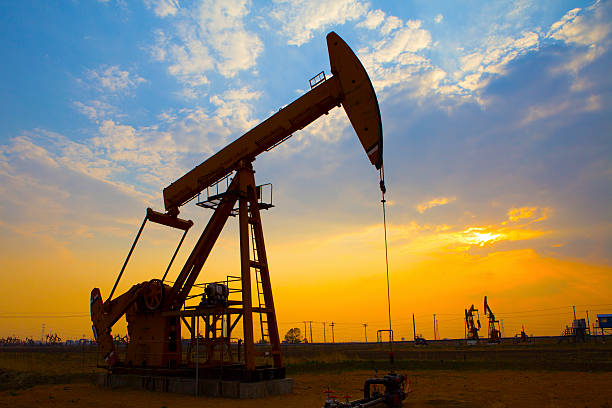 istock Oil drills pumping in the field 186299634