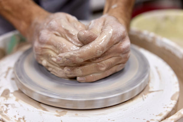 istock male hands making ceramic cup on pottery wheel 1862999667