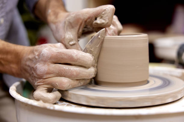 istock male hands making ceramic cup on pottery wheel 1862999796