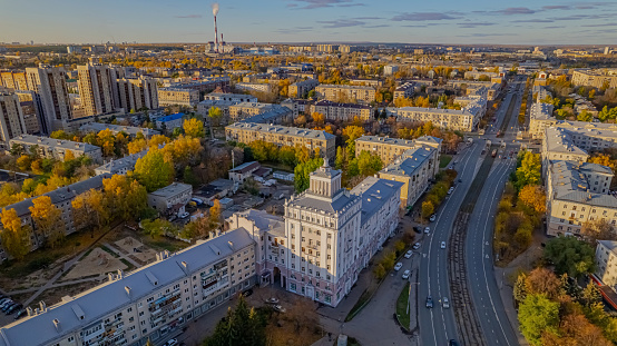 Soviet postwar architecture. White tower on a wide street.