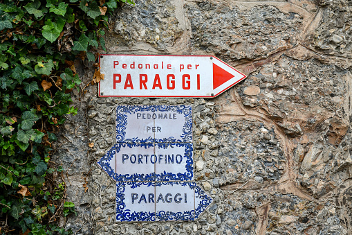 Portofino, Genoa, Liguria, Italy - 08 30 2023: The Walk of the Kisses is a pedestrian path that connects Paraggi to Portofino, overlooking the main road and the sea.