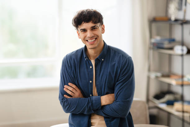 istock Arabic Guy Standing With Folded Arms Near Desk At Home 1863025046