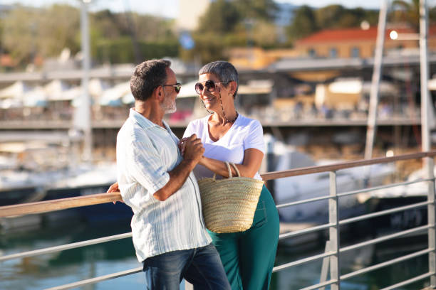 istock Happy Mature Spouses Embracing At Marina Backdrop With Luxury Yachts 1863038165