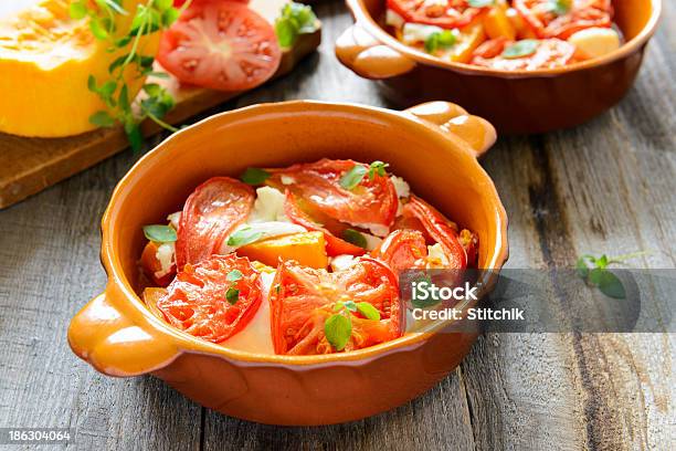 Roasted Pumpkin With Tomato And Oregano Stock Photo - Download Image Now - Autumn, Baked, Cheese