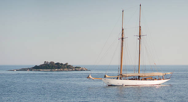 istock sailing boat and island panorama 186304630