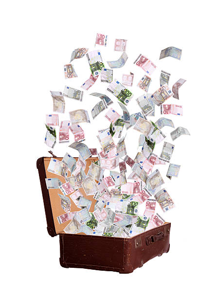 istock euros flying out of old suitcase 186304806