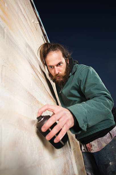 istock Serious Bearded Man Spray Painting 186307342