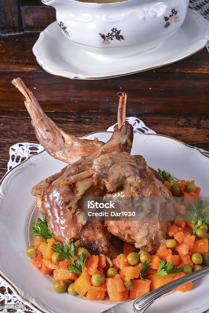 Coniglio arrosto - Foto stock royalty-free di Abbrustolito