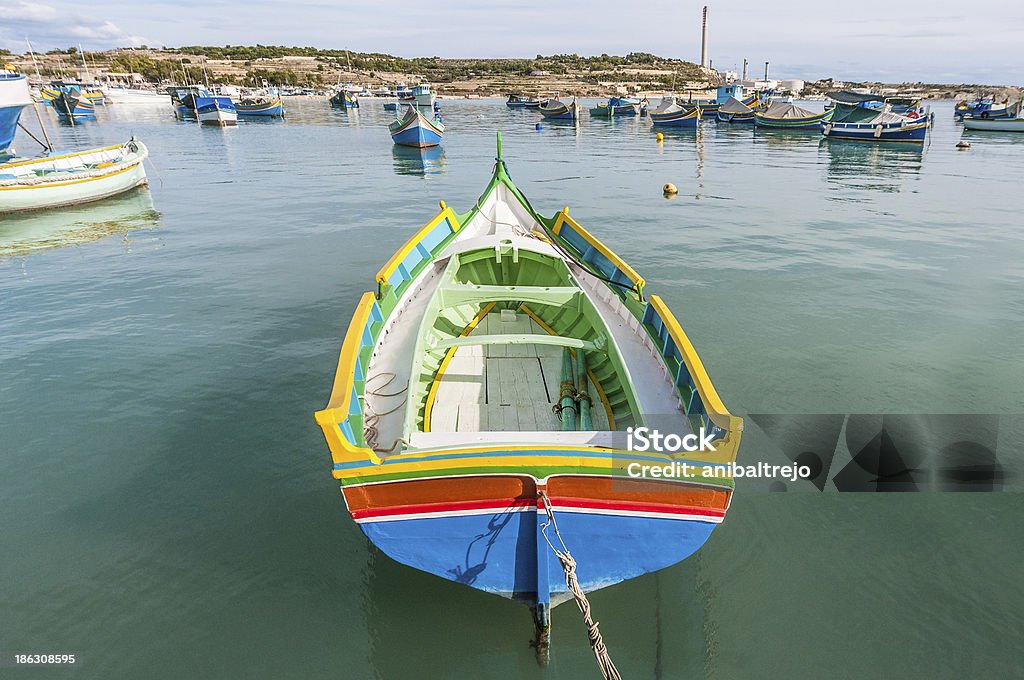 Kajjik Boat at Marsaxlokk harbor in Malta. Traditional Kajjik Boat at Marsaxlokk harbor, a fishing village located in the south-eastern part of Malta. 2018 Stock Photo
