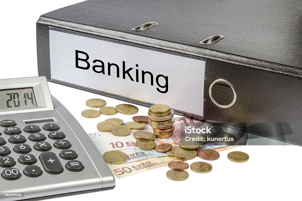 Banking Binder Calculator and Currency A Binder labeled wit the word Banking, calculator and european currency isolated on white background Balance Stock Photo