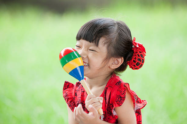 istock Little girl laughing with percussion 186309649