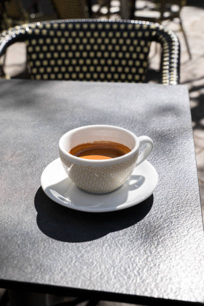 istock cup of Coffee on a terrace, Embracing Shadows 1863097045