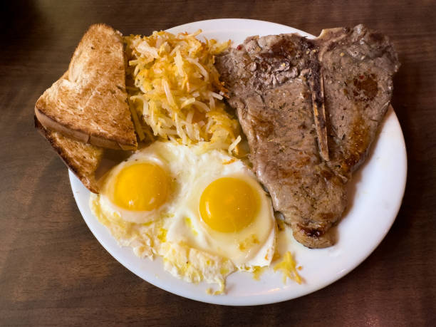 istock American breakfast of T-bone steak and eggs 1863097576