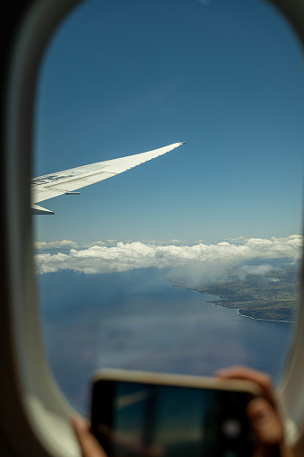 Photographing Easter Island, Chile, with a mobile phone from an airplane window