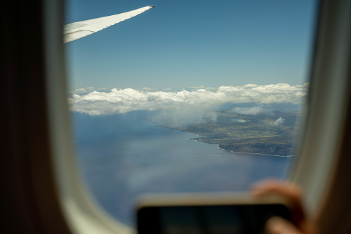 Photographing Easter Island, Chile, with a mobile phone from an airplane window