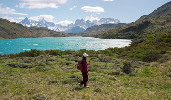 Woman hiking in Torres del Paine National Park，Chile