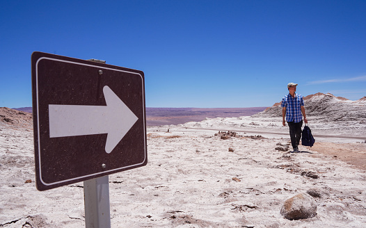Man hiking in Valley of the Moon, Atacama Desert, Chile, South America