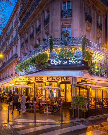 Paris, France - December 10, 2023: The Cafe de Flore restaurant in Saint Germain des Pres during Christmas period in Paris.