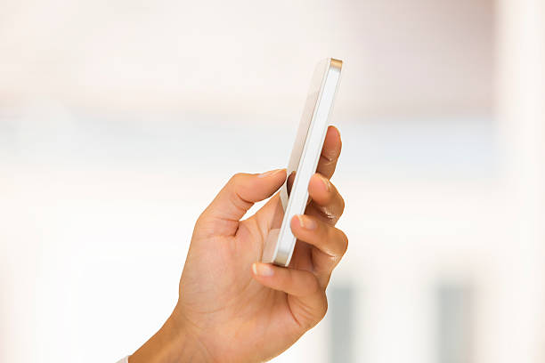 istock Mobile phone in a woman's hand isolated 186313746